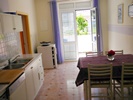 Kitchen and living area apartment white riff kitchen